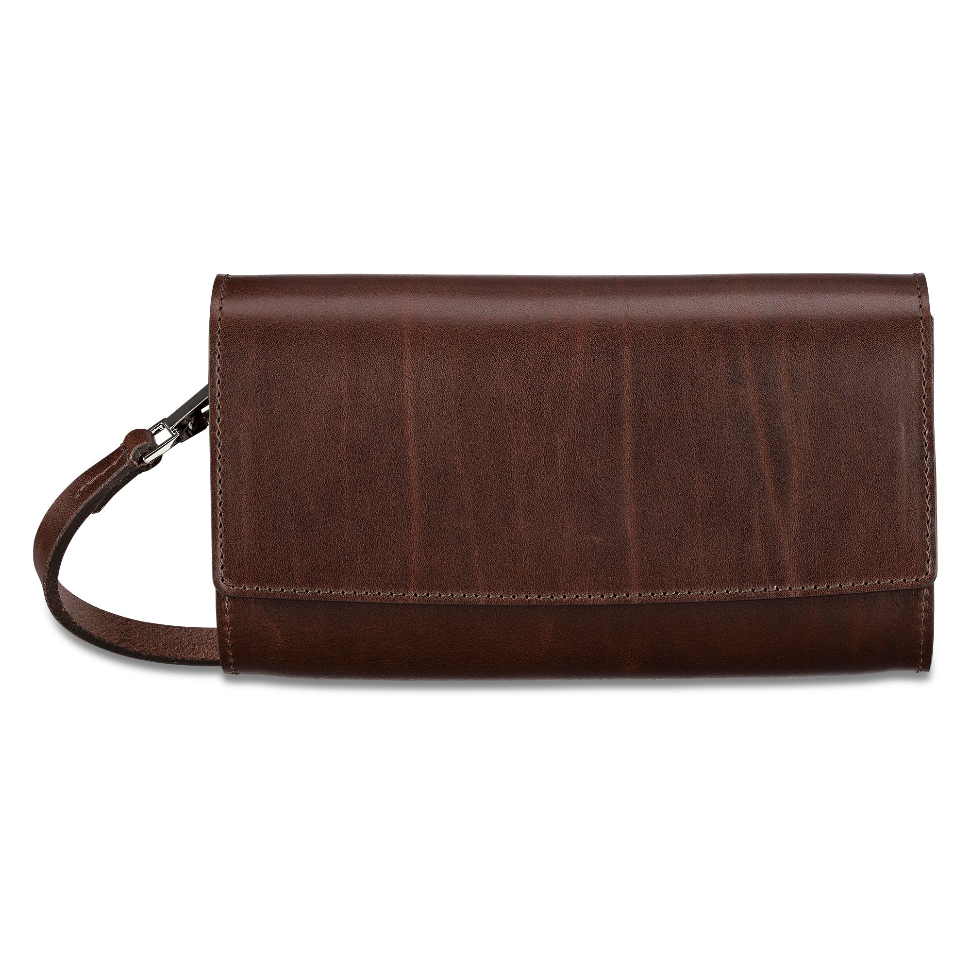 Edle kleine Lederhandtasche aus pflanzlich gegerbtem Leder in Braun. Verschlussklappe mit eingearbeitetem Magneten. Schmaler Riemen zum Umhängen, befestigt mit kleinen silbernen Karabinern.